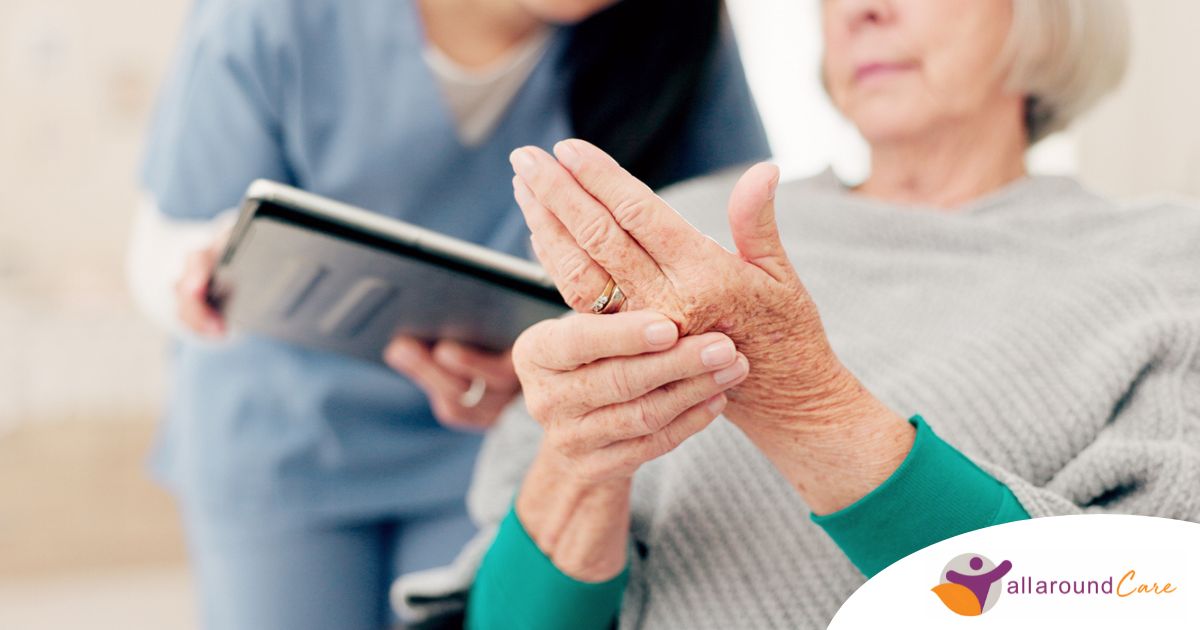 A caregiver provides in home care services to a senior with arthritis