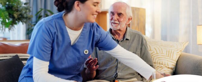 Caregiver providing senior care at home to manage parkinson’s and related symptoms.