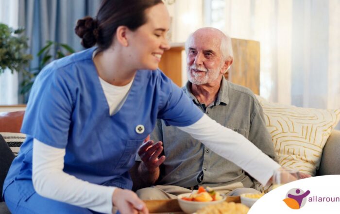 Caregiver providing senior care at home to manage parkinson’s and related symptoms.