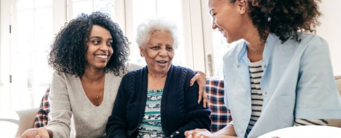 Caregiver talking to a family about Elderly Care