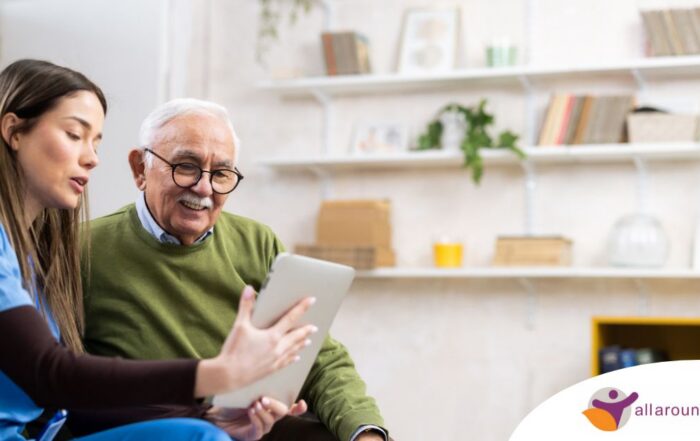 Home caregiver assisting senior man to use telehealth and senior care